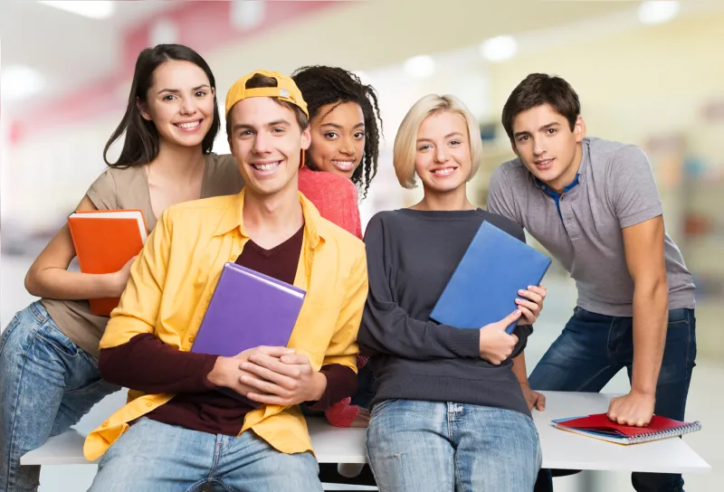 52428-student-holding-books-and-other-figures